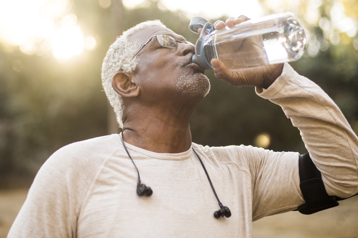 Old man drinking water