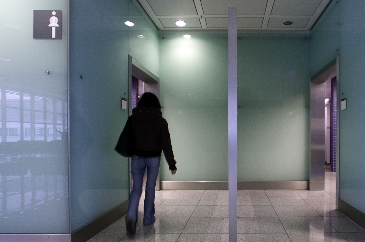 woman walking in an empty hall